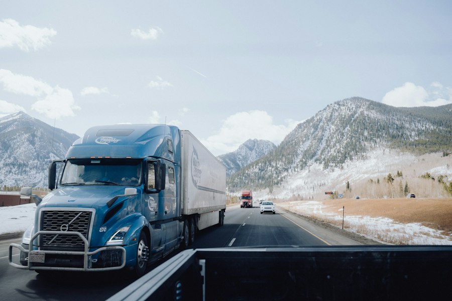 Blue semi-truck on a mountain road