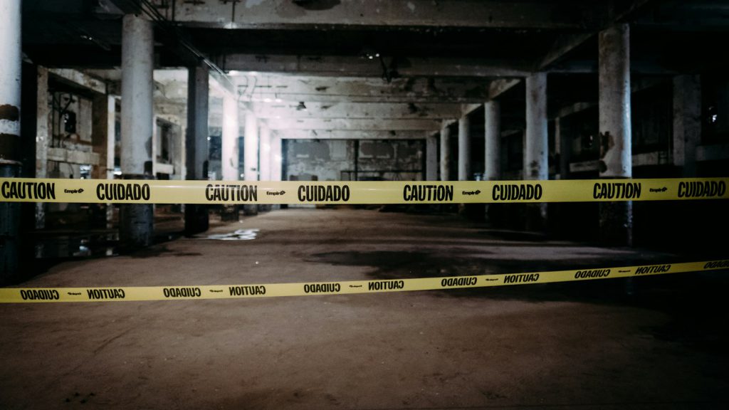 Caution tape in front of a building