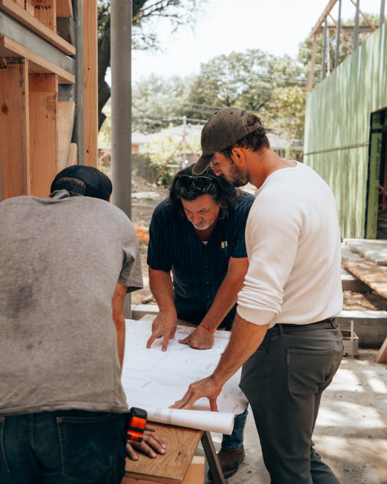 Crew gathered around a sheet of paper