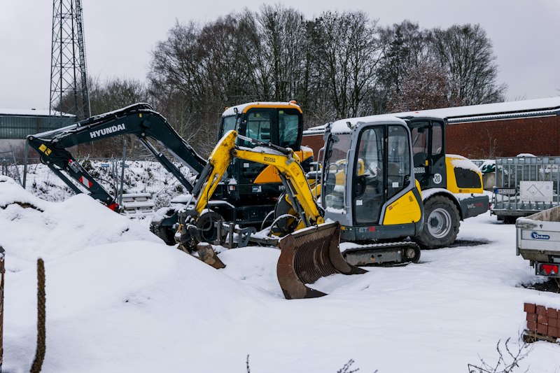 Excavators parked in the snow