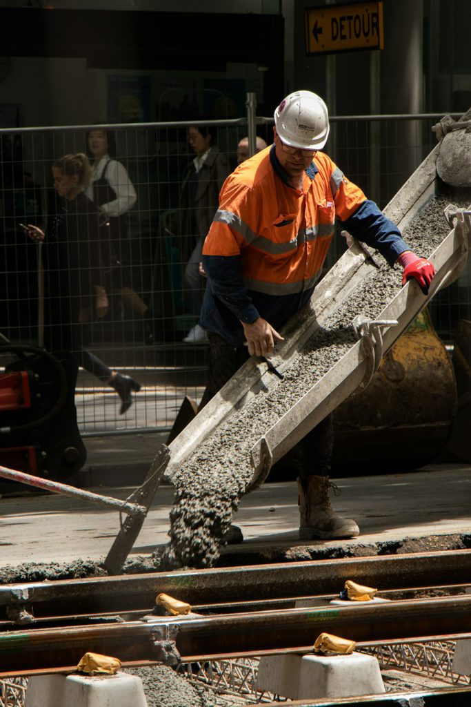 Road crew pouring concrete