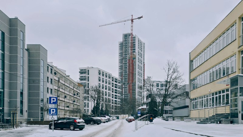 Snowy street with a construction crane