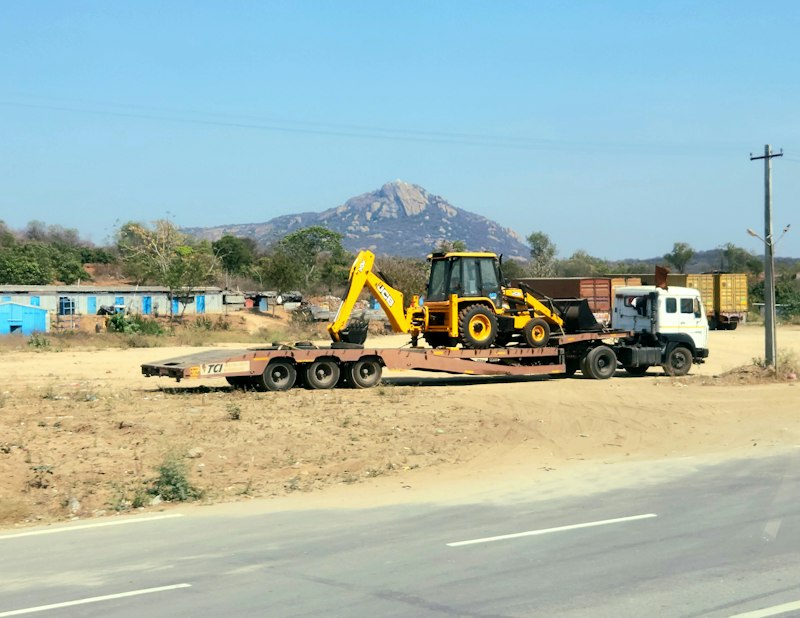 Tractor-trailer hauling construction equipment