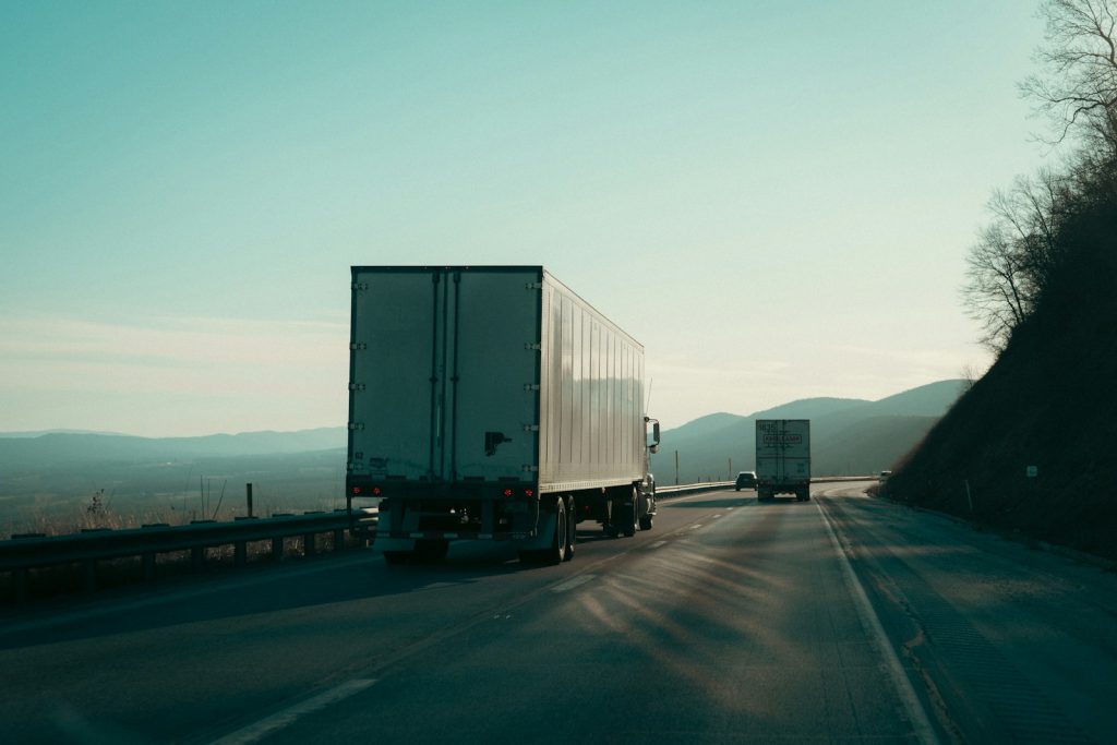 Two semi-trucks on a highway